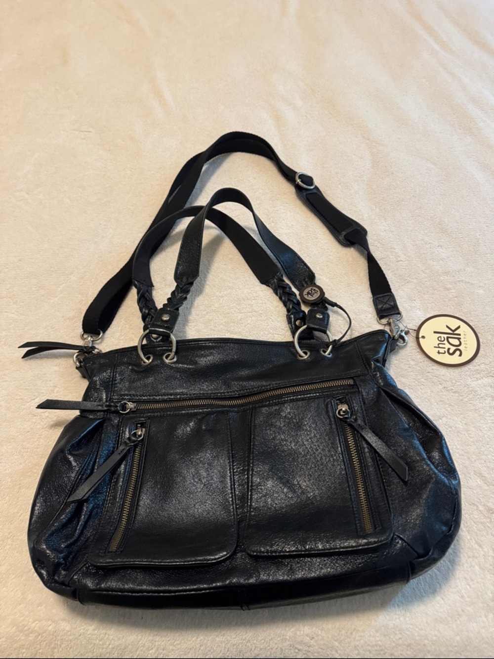 The Sak Black Leather Crossbody Bag with Round Branded Tag